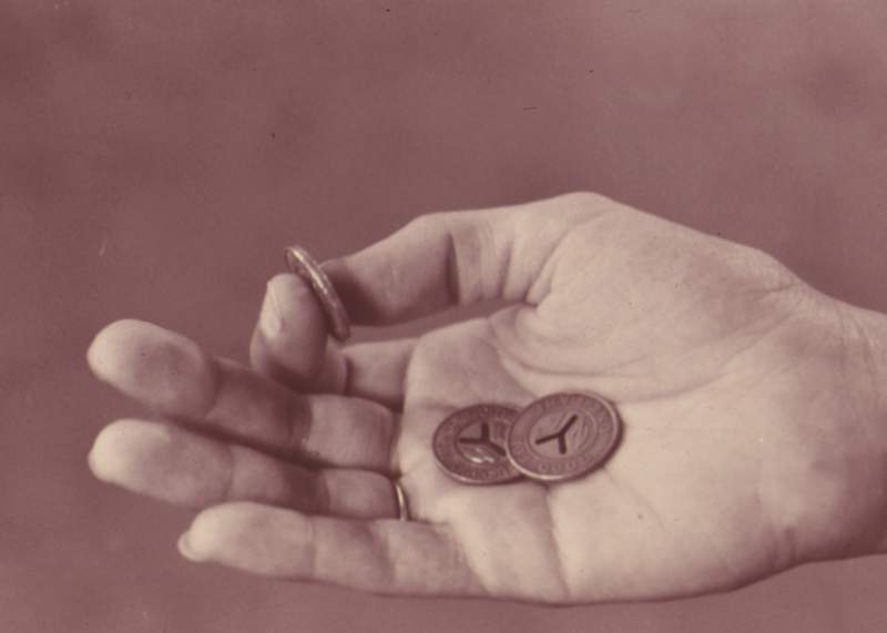 Three second-generation New York City subway tokens (Photo: Wikicommons)